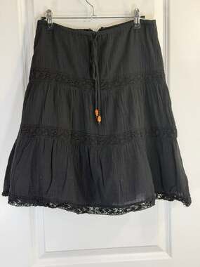 Lucy Love Black Tiered Boho Mini Skirt with Crochet Lace Trim and Beaded Tassels